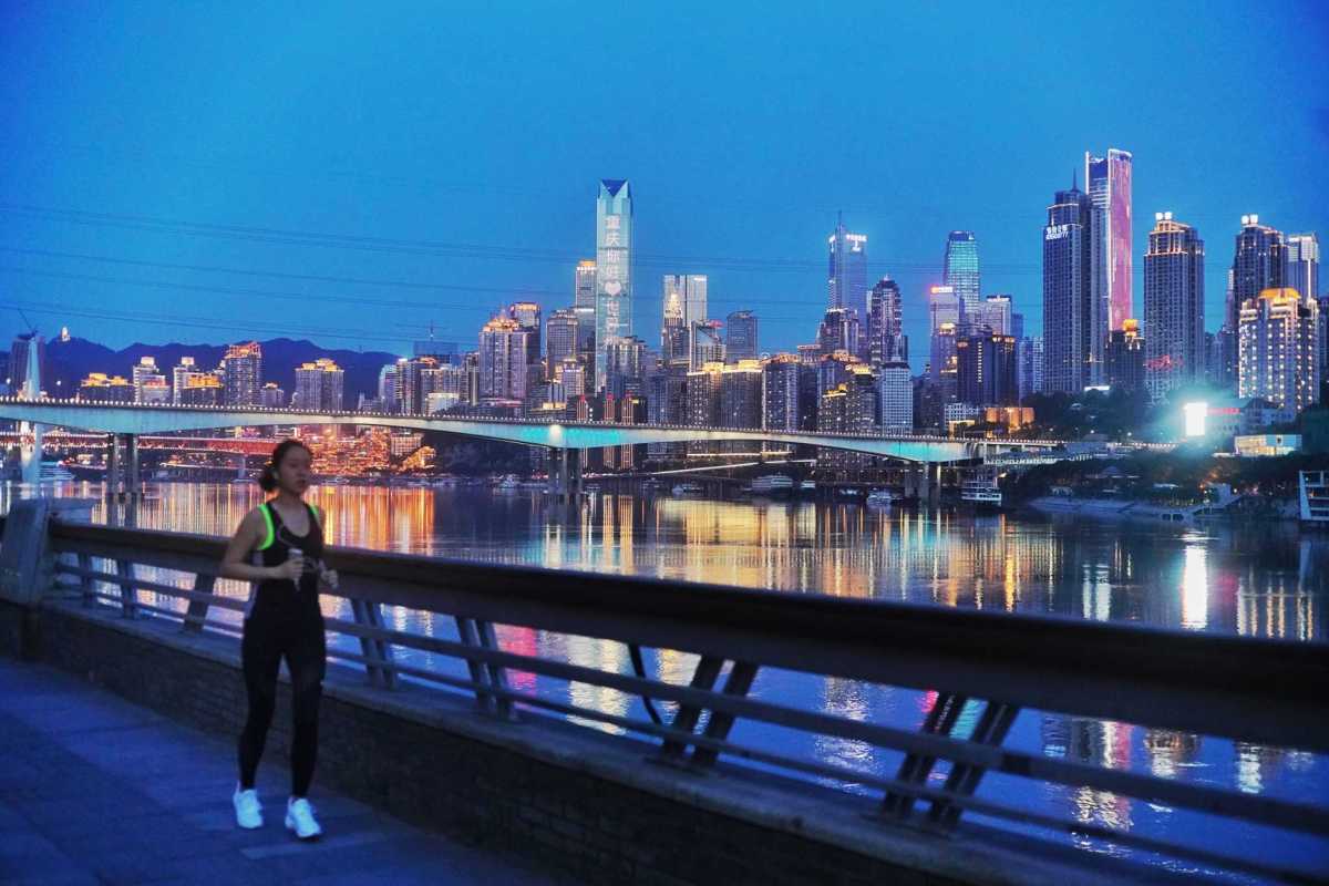 A citizen is jogging along the Jialing River