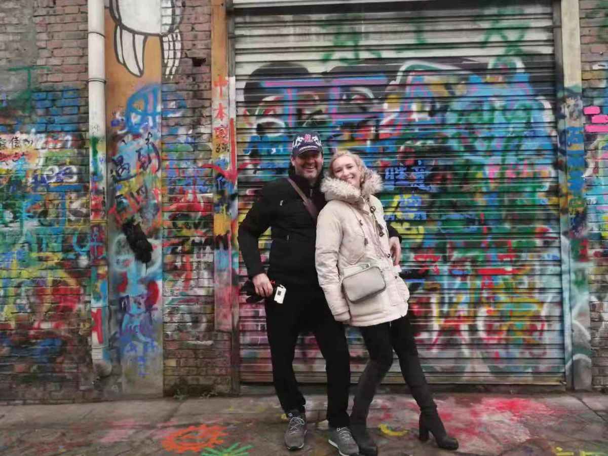 The couple visited the graffiti street.