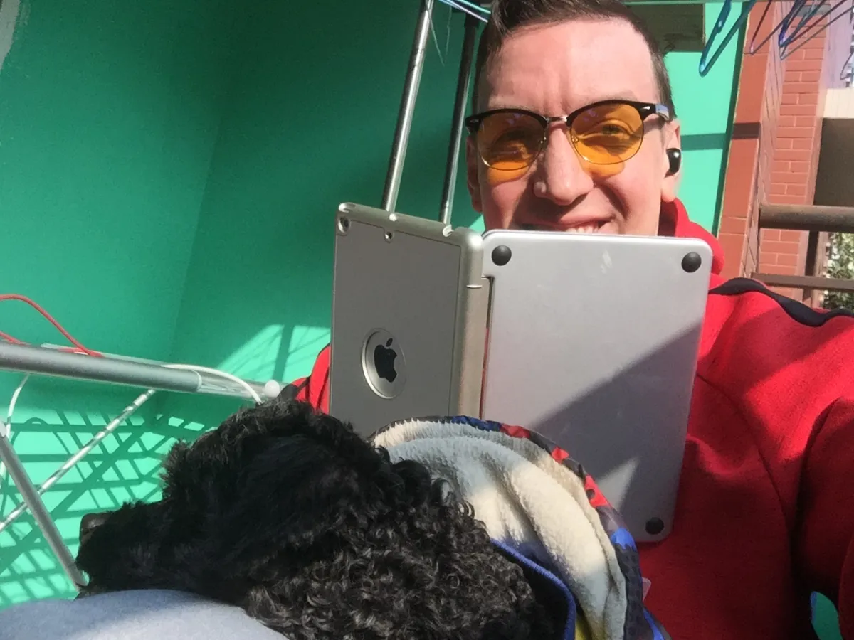 Kai and Hachoo enjoy the hot sun on their balcony.