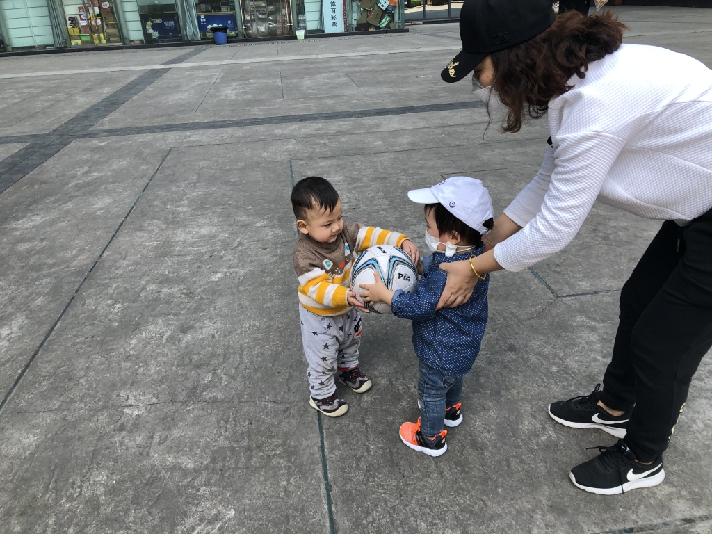 Ethan plays with another baby.