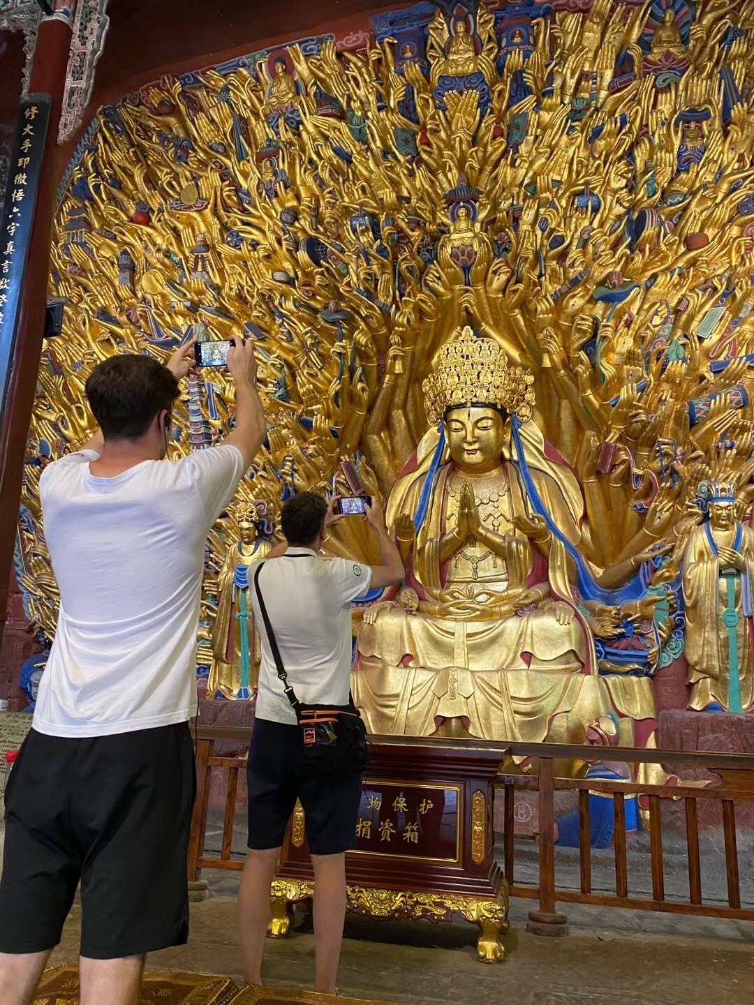 Barrett took photos of the Thousand Hands Buddha in Dazu Rock Carvings
