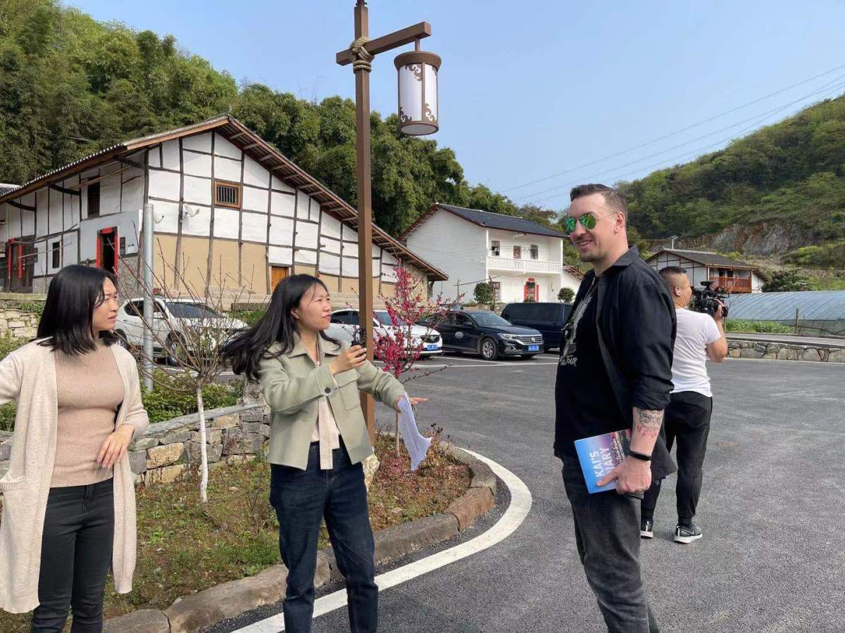 Walking with Xiaosu from Xinhau and local leader, Wu Xianli in peaceful Da Tianchi village, Yubei