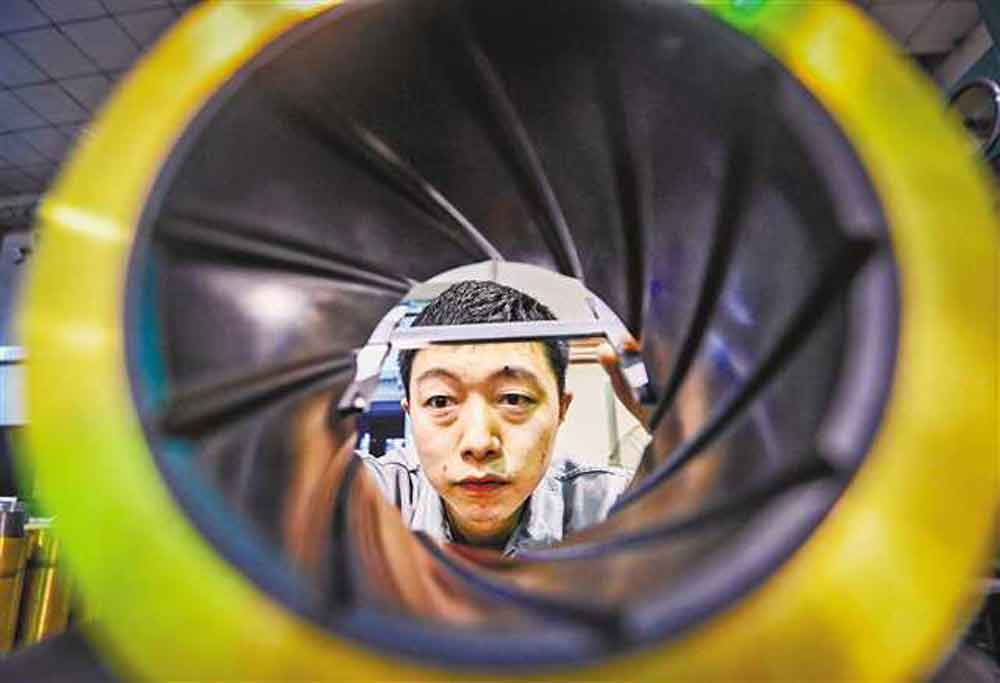 The technician is debugging the robot