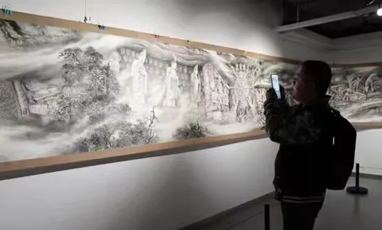 Visitors appreciating the scroll