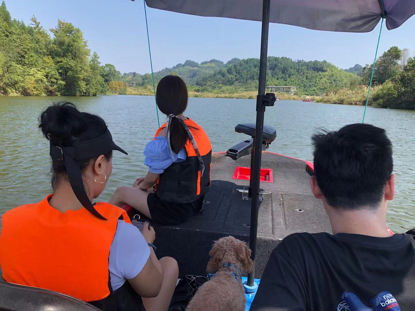 Benben tries 'swimming' from the side of the boat during our relaxing sail around the beautiful lake.