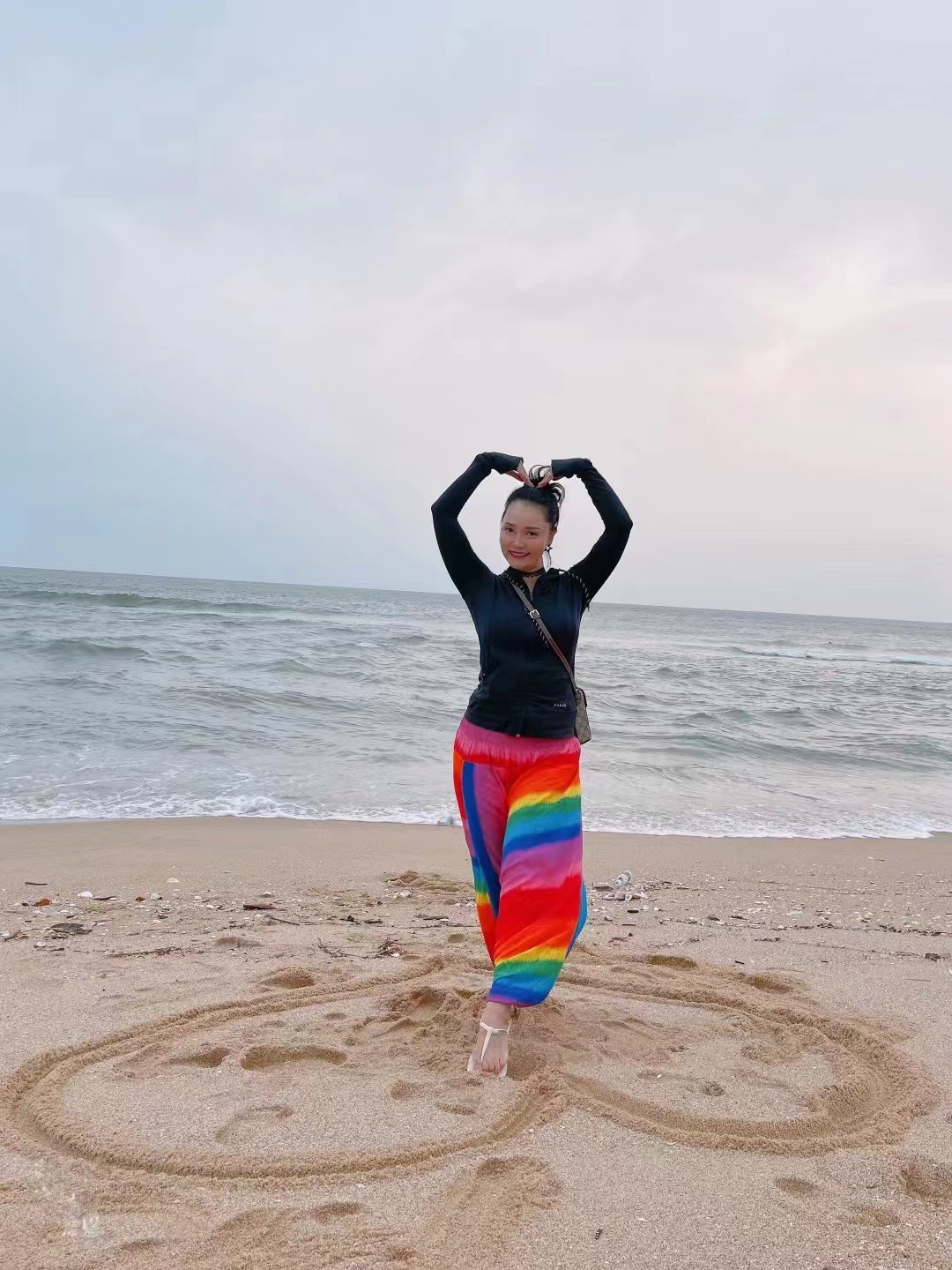Xiaolin on the beach, sending her love.