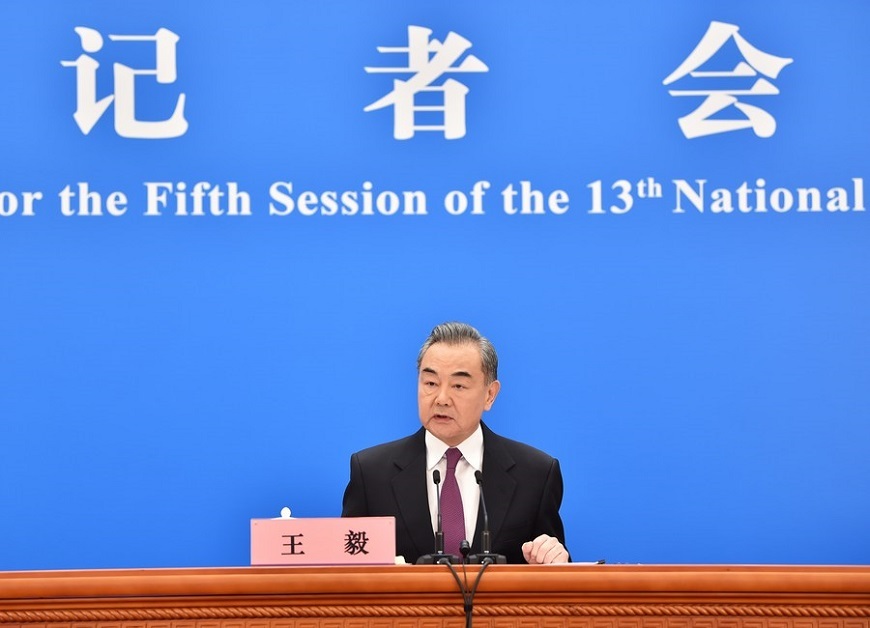 Chinese State Councilor and Foreign Minister Wang Yi attends a press conference on China's foreign policy and foreign relations via video link on the sidelines of the fifth session of the 13th National People's Congress (NPC) at the Great Hall of the People in Beijing, capital of China, March 7, 2022.