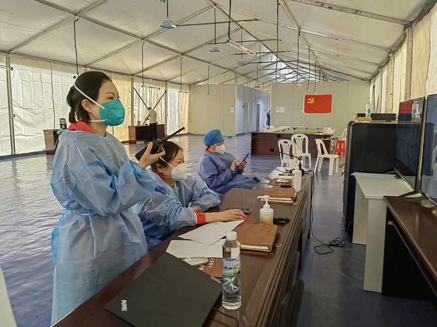 Zhao was dispatching work at the front line of the makeshift hospital.