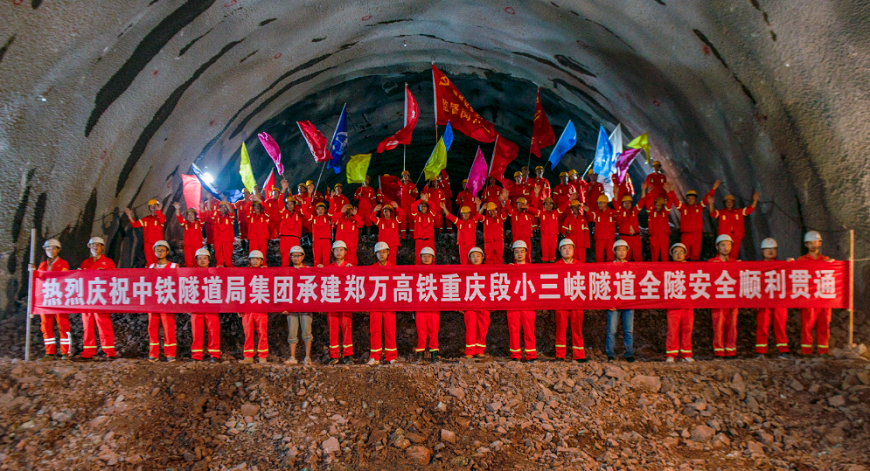 All the Lesser Three Gorges Tunnel project staff celebrating the transfixion of the tunnel.