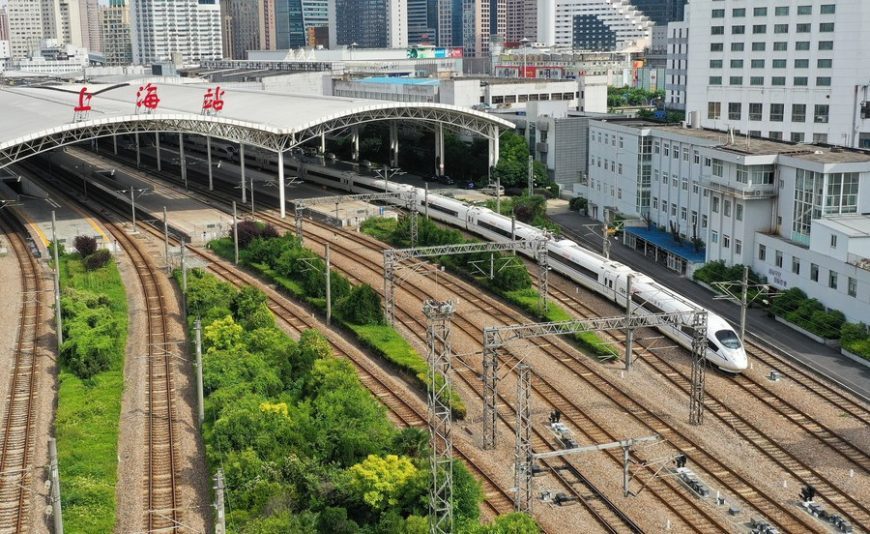 Aerial photo taken on May 18, 2022 shows a high-speed train pulling out of the Shanghai Railway Station in east China's Shanghai.