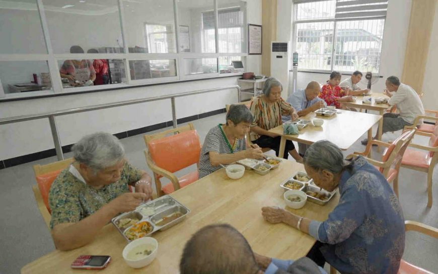 Senior citizens enjoy affordable meals in a public eldercare center's canteen in Anren, Zhejiang province, in September