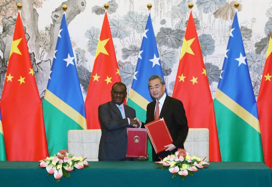 State Councilor and Foreign Minister Wang Yi and Solomon Islands' Minister of Foreign Affairs and External Trade Jeremiah Manele sign a joint communique on the establishment of diplomatic relations after their talks in Beijing, Sept 21, 2019. Wang Jing