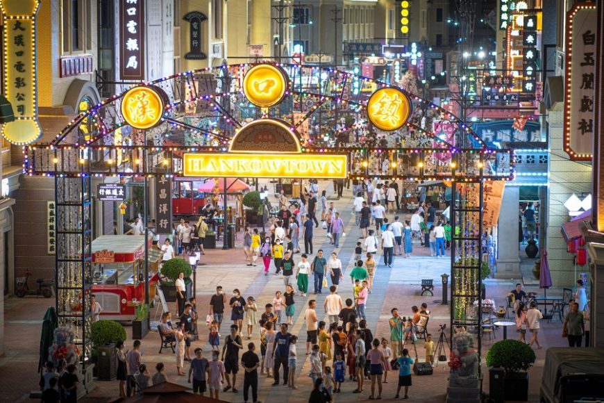 This photo shows a night view of a commercial street in Wuhan City, central China's Hubei Province, July 2, 2022.