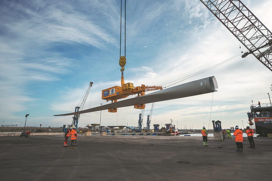 Workers hoist wind turbines in Taranto Port in Italy in January.