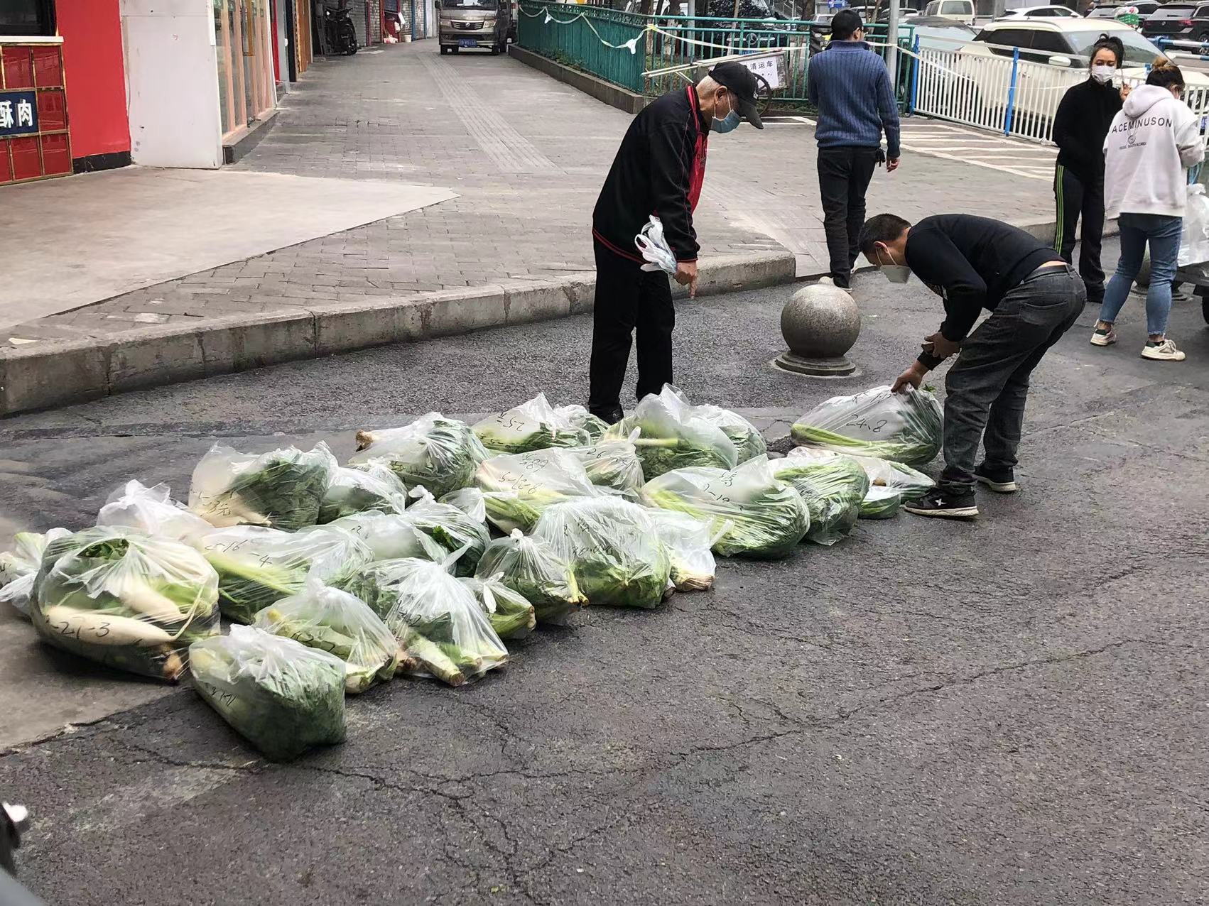 Curbside delivery of essential vegetables before the gates got sealed up entirely - now it's delivery to our door.