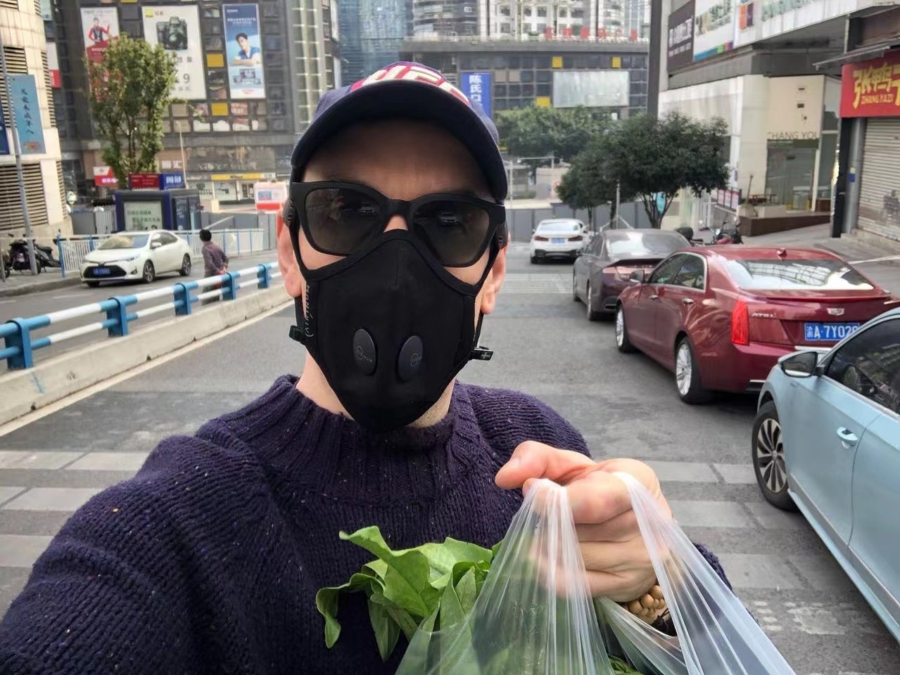 One last shopping trip outside the house, on quiet Chongqing streets.
