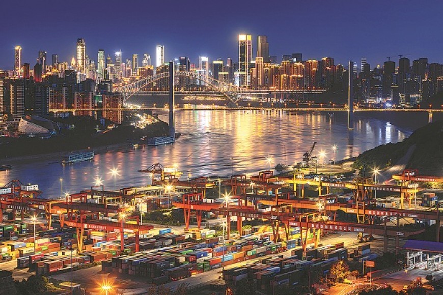 Cuntan Port by the Yangtze River in Chongqing bustles with work at night.
