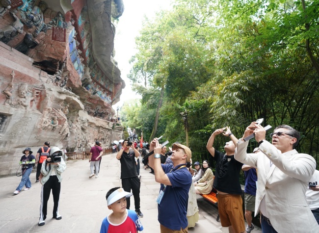 Diplomatic Envoys Marvel at the Magnificent Dazu Rock Carvings