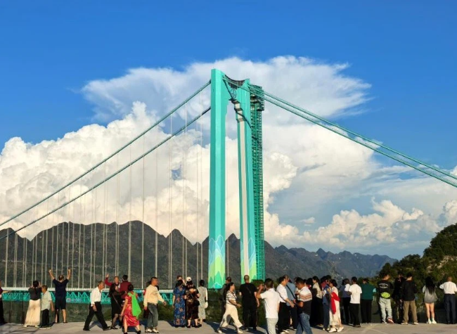 Across China: World's Tallest Bridge Brings Local Tourism to New Heights